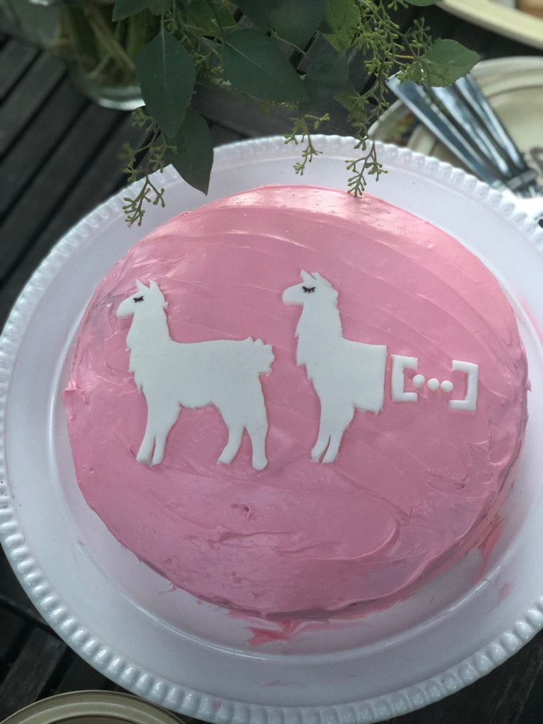 A dissertation cake for Dr. Kroll, "[untitled]", prepared by Kelsey Kraus (PhD '18). White cake with fresh cherry filling and cream cheese frosting, with fondant llama antecedent & ellipsis site.